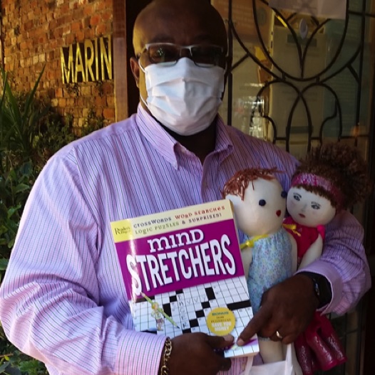 Darnell from Marin Terrace accepted items donated by the Knitting Group